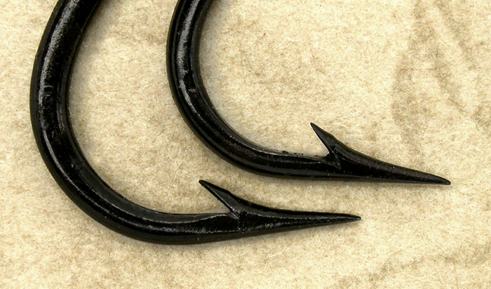Two oval wire hooks, about #1 & 1/0.