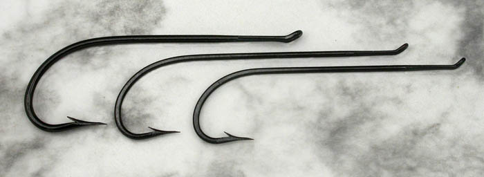 Three up eye salmon hooks, about 6/0, 5/0 & 4/0. Very nice hooks from a varied batch of hooks I bought from the UK. These, some oval wire hooks and some lesser hooks were in the bunch. These have nicely hand filed points.