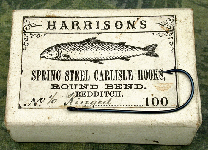 9a Harrison’s, #1/0, round bend, blued, ringed straight eye, Carlisle hooks, 1 3/8” long, Redditch England.